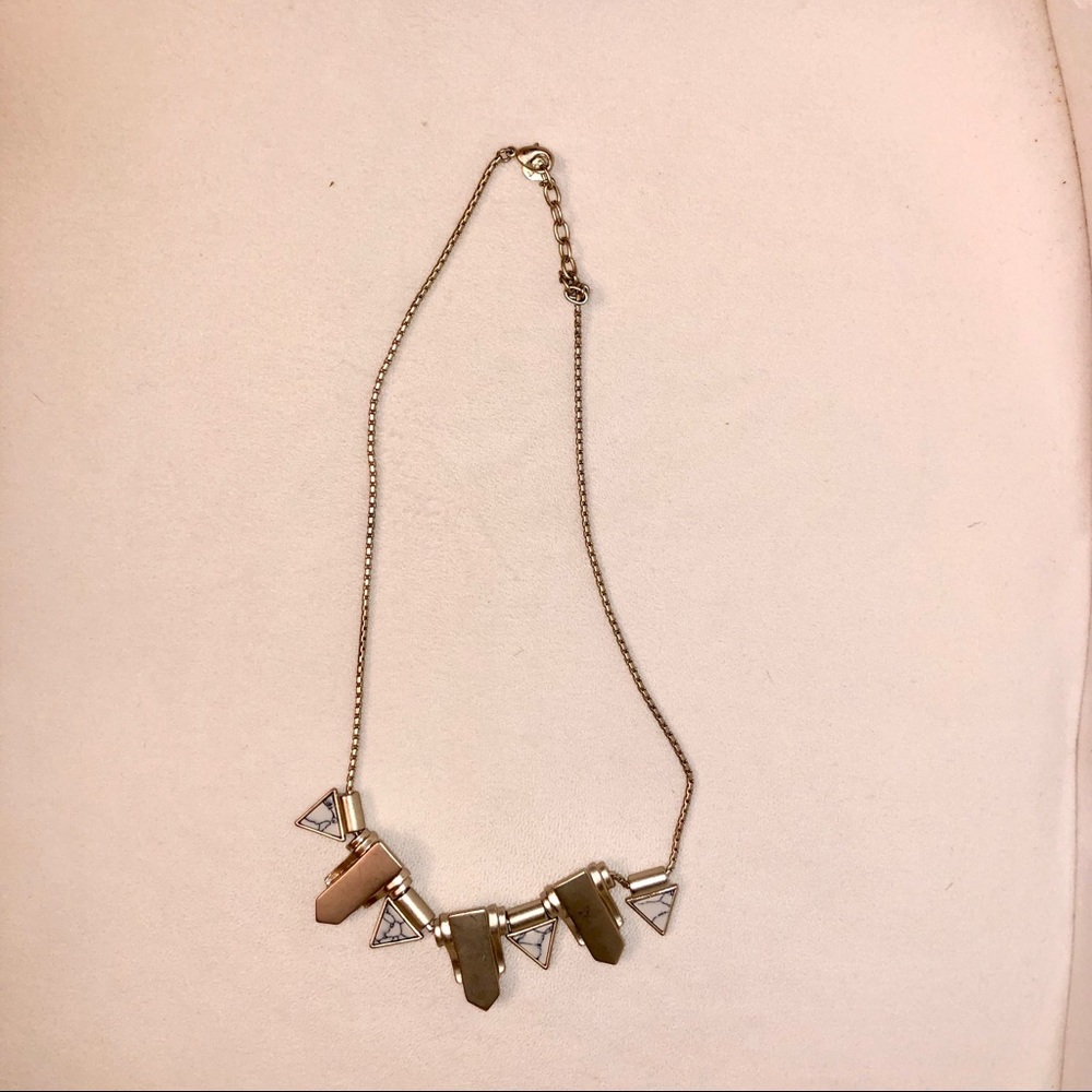 Gold necklace with white marble